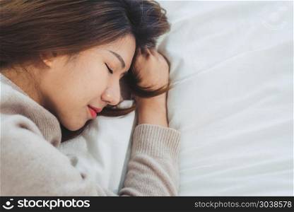 Beautiful young Asian woman sleeping in bed in the morning. Attr. Beautiful young Asian woman sleeping in bed in the morning. Attractive asian girl use bedtime in her comfortable bedroom. Relaxation bedroom. Iifestyle asia woman at home concept.