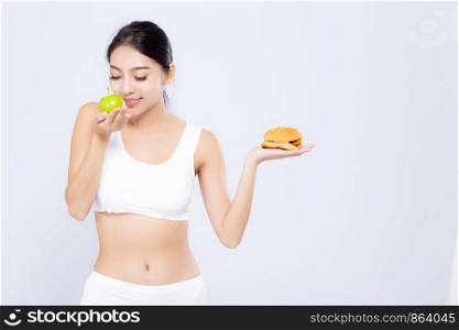 Beautiful young asian woman slim shape with diet choosing fresh salad vegetable and hamburger isolated on white background, food healthy with control for weight loss with calories, nutrition and lifestyle concept.