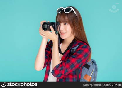 Beautiful young asian woman smiling is journalist photographer wear fashion travel summer, girl holding camera hobby tourist and trip in vacation and holiday isolated on blue background.