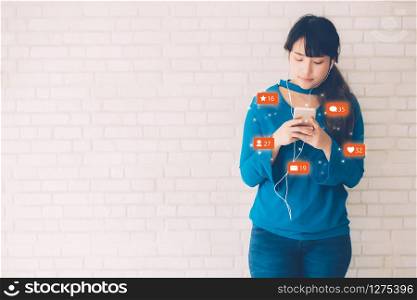 Beautiful young asian woman using smart mobile phone looking and social media online, asia girl having interaction notification and community on smartphone in internet, digital marketing concept.