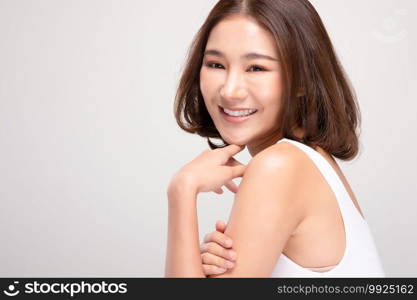 Beautiful Young Asian Woman with short hair Looking While Touching Chin feeling so happy and cheerful with healthy Clean and Fresh skin,isolated on white background,Beauty Cosmetics Concept