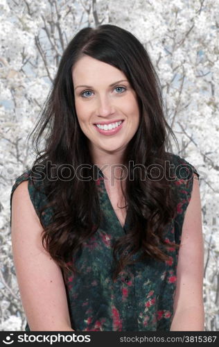 Beautiful young attractive woman modeling a pose. Sunset over a Lake