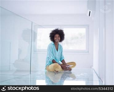 beautiful young black women using tablet computer on the floor at home