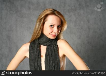 beautiful young blond woman in jeans studio shot