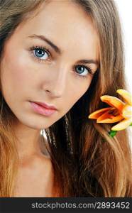beautiful young blond woman with flower in her hands