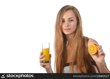 beautiful young blond woman with half of orange and glass of juice in her hands