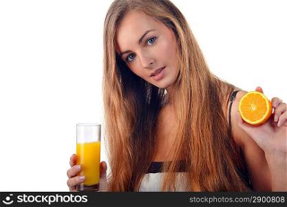 beautiful young blond woman with half of orange and glass of juice in her hands