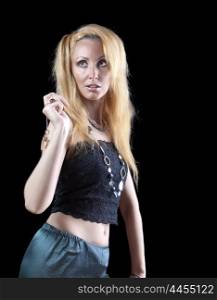 beautiful young blonde woman with long hair and jewellery on dark background.