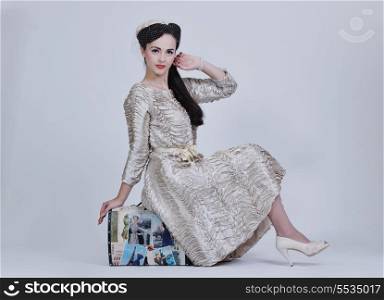 beautiful young bride wearing wedding dress in retro fashion style isolated on white background in studio