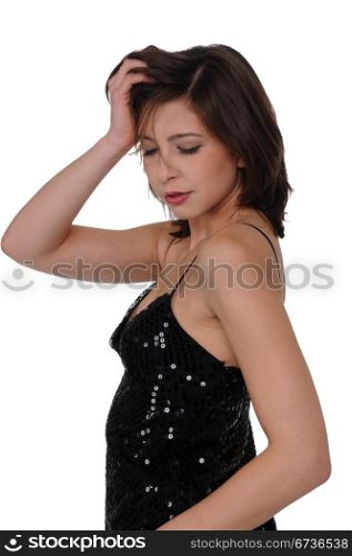Beautiful young brunette in a sequined black dress