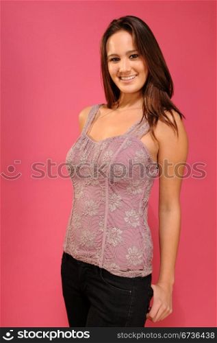 Beautiful young brunette in an embroidered lavender top