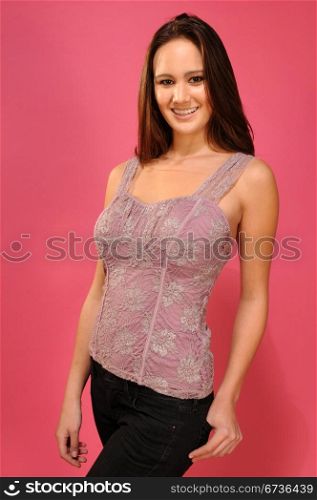 Beautiful young brunette in an embroidered lavender top
