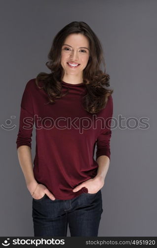 beautiful young brunette woman in a red blouse posing and expresses different emotions. close-up portret