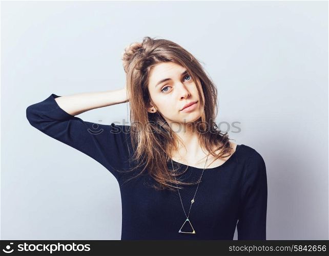 Beautiful young business woman having a headache and holding her hands near head