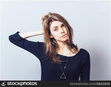 Beautiful young business woman having a headache and holding her hands near head