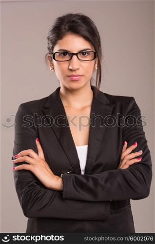 Beautiful young business woman posing isolated over copy space background
