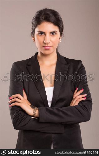 Beautiful young business woman posing isolated over copy space background