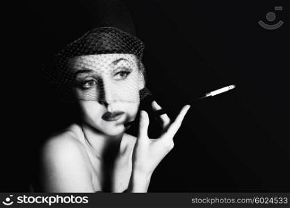 beautiful young caucasian woman in veil with cigarette