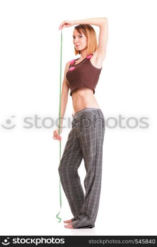Beautiful young caucasian woman measuring her body with tape, isolated on white background