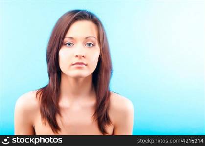 beautiful young caucasian woman on blue background