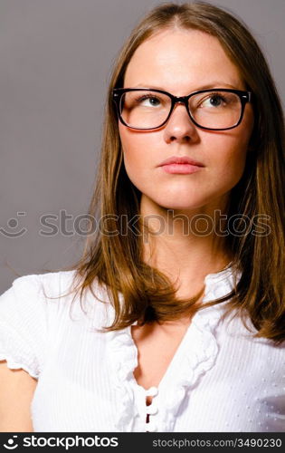 beautiful young caucasian woman on gray background