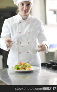 beautiful young chef woman prepare and decorating tasty food in kitchen