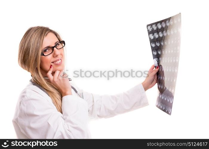 Beautiful young doctor looking at some exams, isolated over white