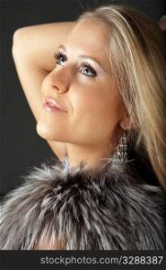 Beautiful Young dreamy woman in fur