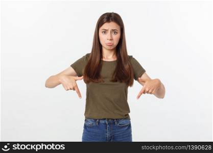 Beautiful young elegant woman over isolated background pointing hand and fingers with sad expression. Beautiful young elegant woman over isolated background pointing hand and fingers with sad expression.
