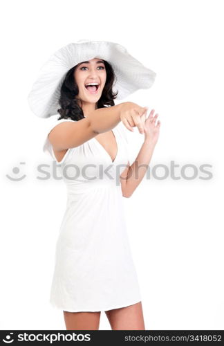 beautiful young fashion woman in white dress and hat points