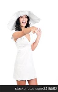 beautiful young fashion woman in white dress and hat points