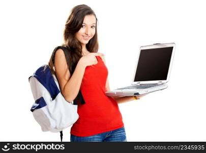 Beautiful young female student showing something on a laptop, isolated on white