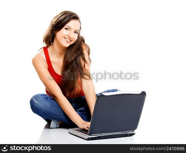 Beautiful young female student with a laptop, isolated on white