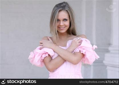 Beautiful young girl in pink dress