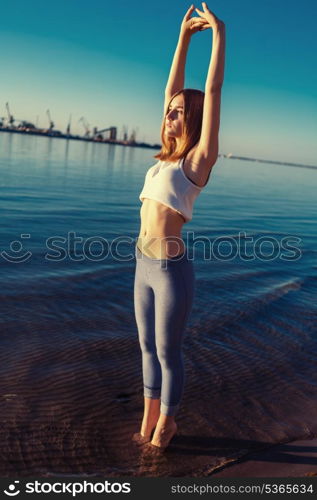 beautiful young girl in the morning in the water