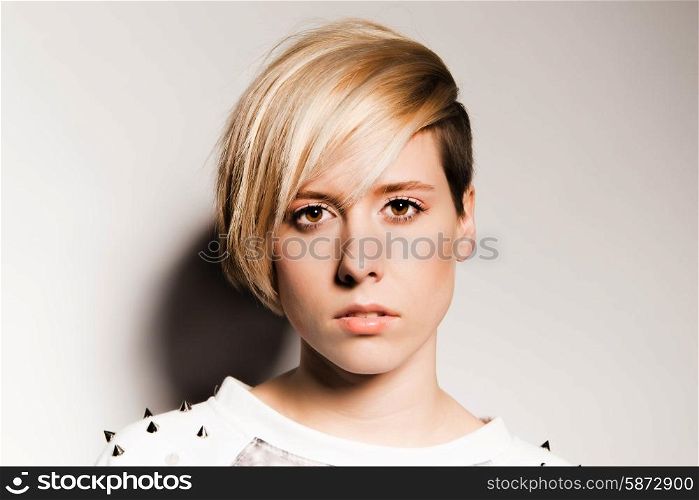 Beautiful young girl on a light background