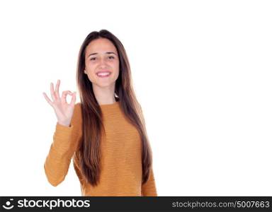 Beautiful young girl showing ok sign with her hand isolated on a white background