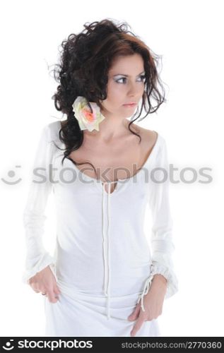 beautiful young girl with a rose in her hair. Isolated on white background
