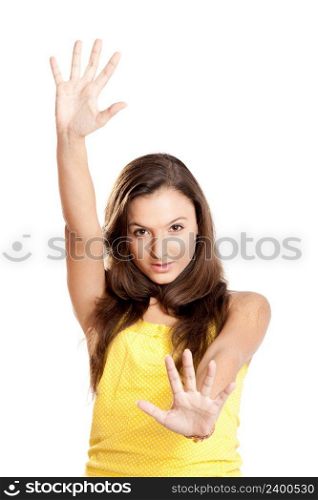Beautiful young girl with both hands on the air, isolated on white
