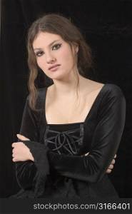 Beautiful young girl with gothic makeup and clothing