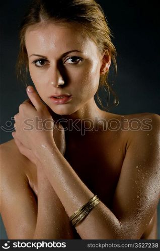beautiful young girl with water drops on a body