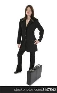 Beautiful young Hispanic business woman dressed in black suit. Standing beside her briefcase looking into distance.