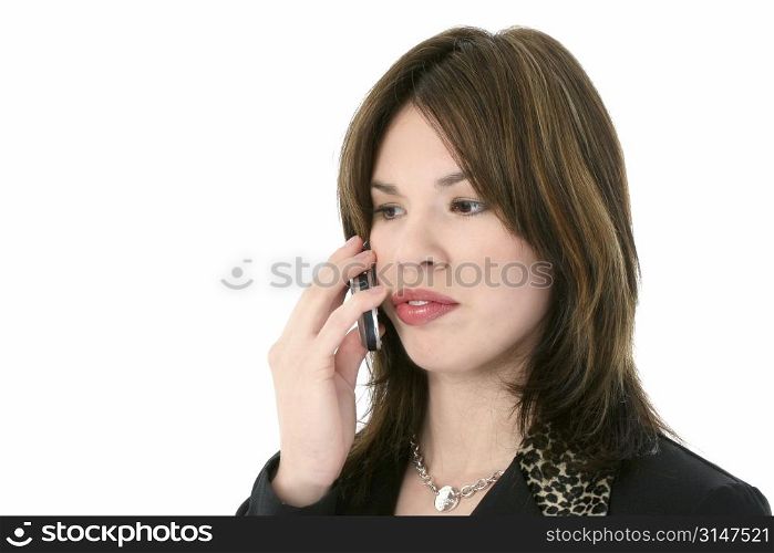 Beautiful young Hispanic woman in business suit speaking on cellphone.