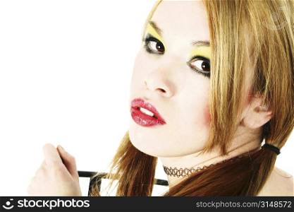 Beautiful young Hispanic woman in goth make-up. Shot in studio.