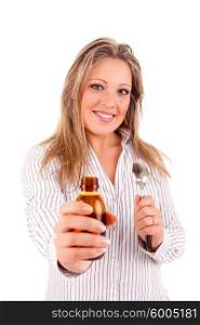 Beautiful young ill woman drinking syrup