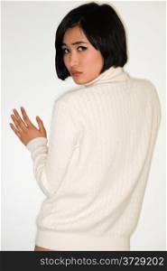 Beautiful young Japanese woman in a white knit sweater