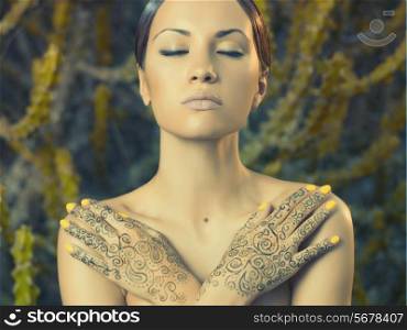 Beautiful young lady with painted hands mehendi