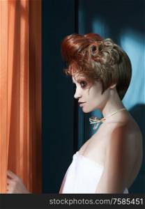 Beautiful young lady with red hair in blue interior. sunlight photography of stylish lady in white classic dress