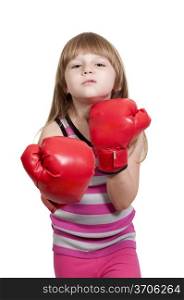 Beautiful young little girl wearing a pair of boxing gloves