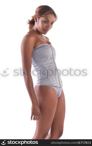 Beautiful young multiracial woman in a gray corset